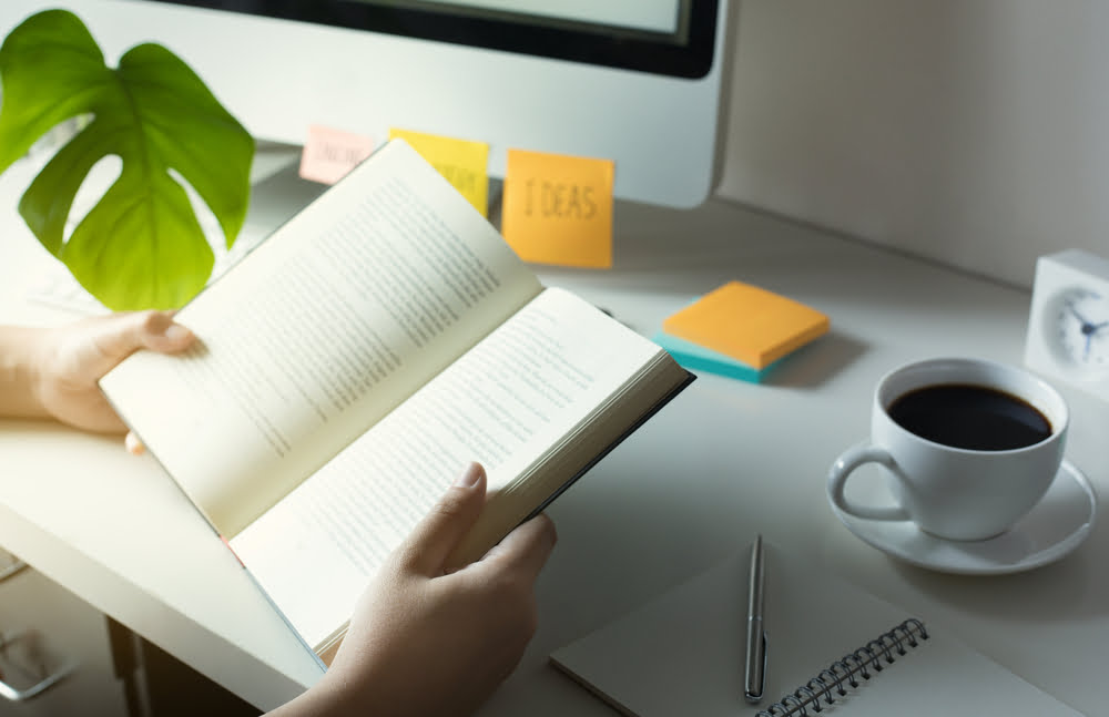 Woman Reading Business Development Book